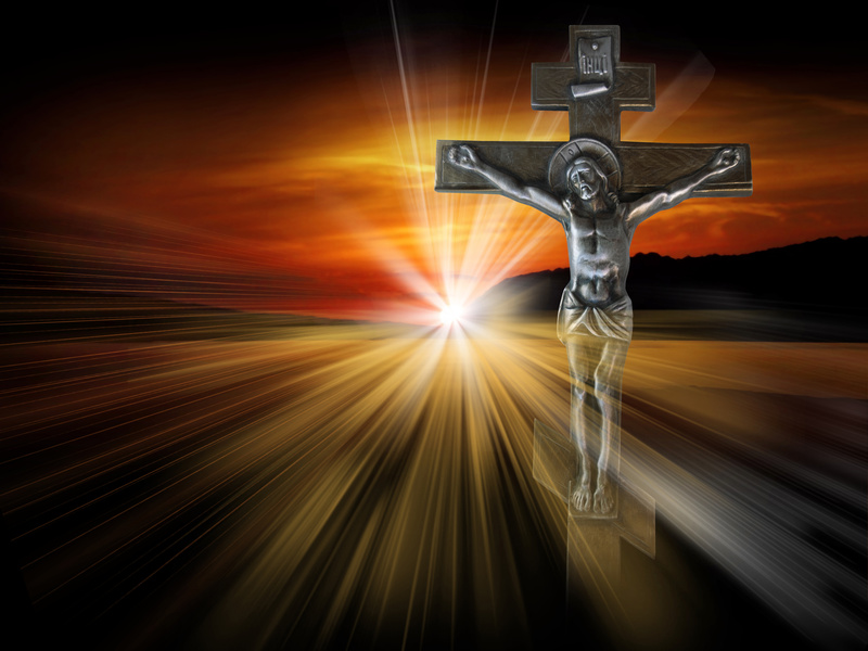 Vor einem hellen Licht steht das Kreuz mit dem Leib Christi!